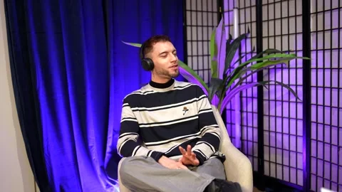 Content creator talking during live podcast session Stock Footage 328633584