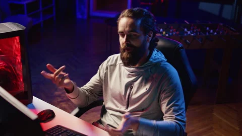 Content creator testing different approaches to win videogame while streaming Stock Footage 260667572