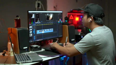 Content creator working with computer for editing video footage Stock Footage 232613667