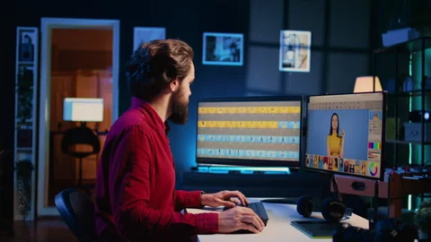 Content creator working in graphic design studio, selecting best editorial Stock Footage 257723384