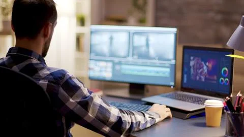 Content creator working on post production for a multimedia project Fotos Stock