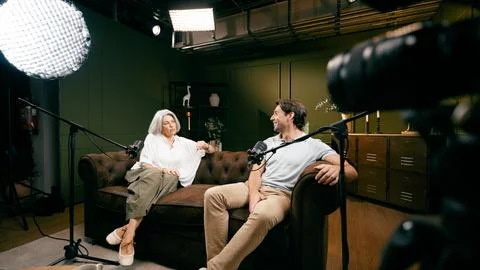 Content creators recording podcast interview in studio Stock Photos