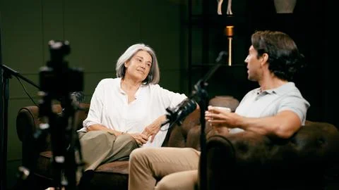 Content creators recording podcast interview in studio Stock Photos
