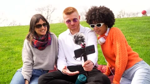 Content creators recording a podcast outdoors Stock Footage 306354680