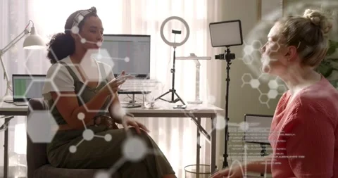 Content creators starting planning session by pointing at computer setup while Stock Footage 320416243