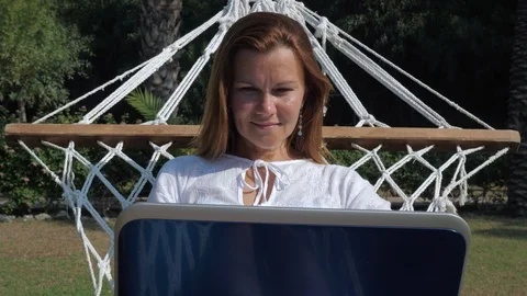 Content female freelancer using laptop on vacation Video stock 124630847