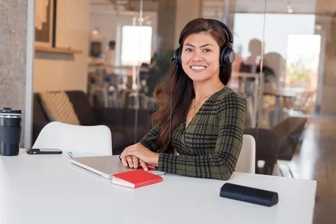 Content female operator at working desk Stock Photos