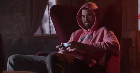 Content guy playing videogame in bar Video stock 229485405