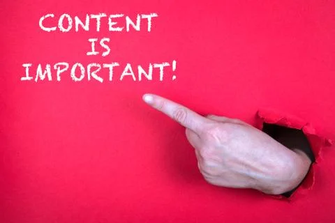 CONTENT IS IMPORTANT. Hand finger pointing on red background Stock Photos
