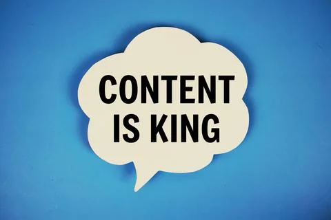 Content Is King text with speech bubble top view on blue background Stock Photos