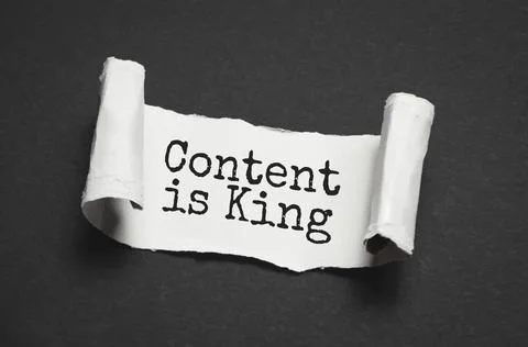 CONTENT IS KING text on white torn paper Stock Photos