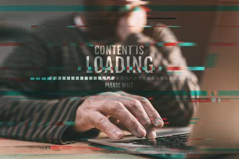 Content is loading, please wait - man browsing internet on laptop computer Stock Photos