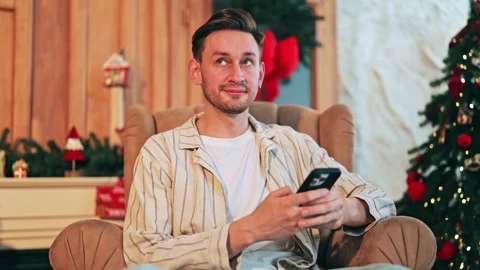 Content Man Enjoying Holiday Time With Mobile Phone Stock-Footage 319705166