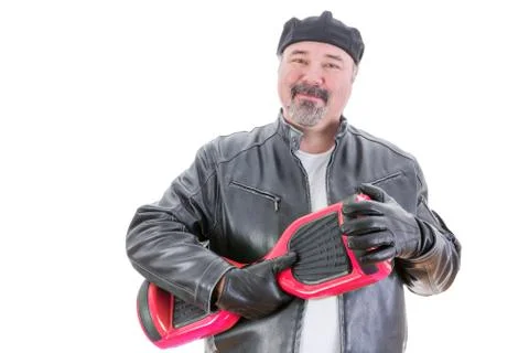 Content man in leather jacket holding hoverboard Stock Photos
