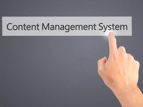 Content Management System - Hand pressing a button on blurred background conc 스톡 사진