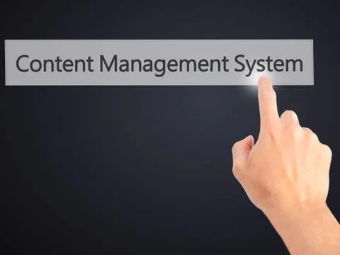 Content Management System - Hand pressing a button on blurred background conc 스톡 사진