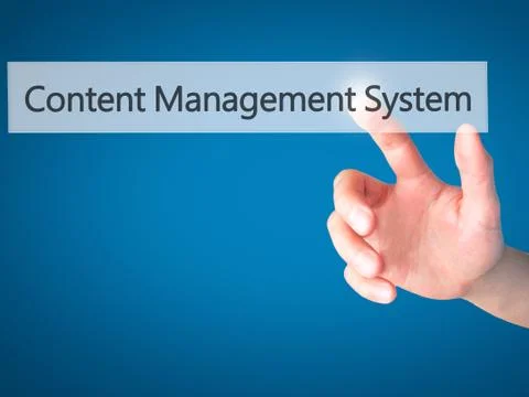 Content Management System - Hand pressing a button on blurred background conc 스톡 사진