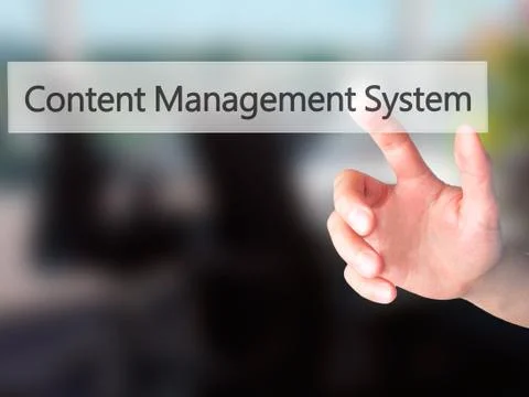 Content Management System - Hand pressing a button on blurred background conc 스톡 사진
