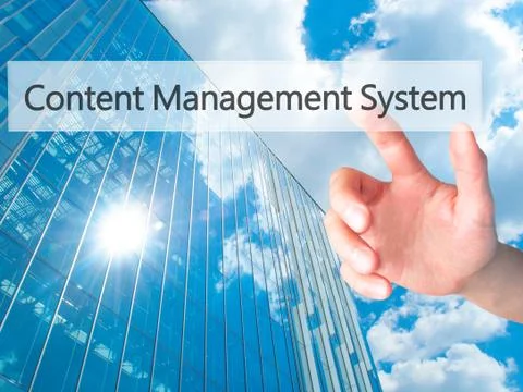 Content Management System - Hand pressing a button on blurred background conc 스톡 사진