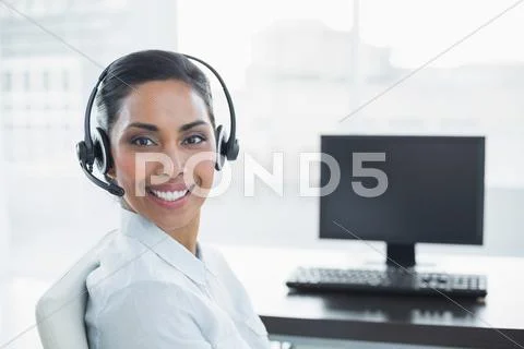 Content smiling agent wearing a headset Stock Photos
