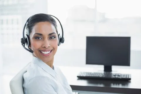 Content smiling agent wearing a headset Stock Photos