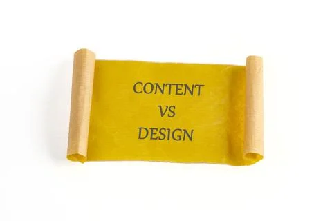 Content vs Design concept written on a yellow torn paper scroll against a whi Stock Photos