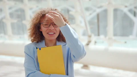 Content Young cute Professional Embracing Notebook in Geometrically Inspired Stock Footage 274048877