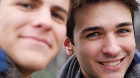 Content young men posing at camera for selfie Stock Photos