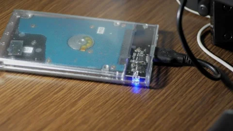 The contents of the portable hard disk being accessed via a computer are in.. Vídeos de archivo 241995761