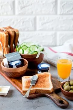 Continental Breakfast with Orange Juice Includes toast with butter, orange .. Stock Photos