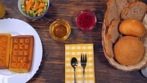 Continental breakfast on a wooden table Stock Footage 112089087