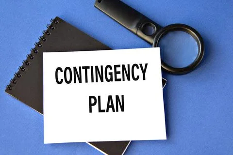 CONTINGENCY PLAN - words on a white sheet on a black notebook with a magnifyi Stock Photos