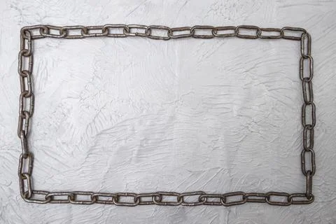 Continuous chain frame flat lay on gray cement background Foto stock
