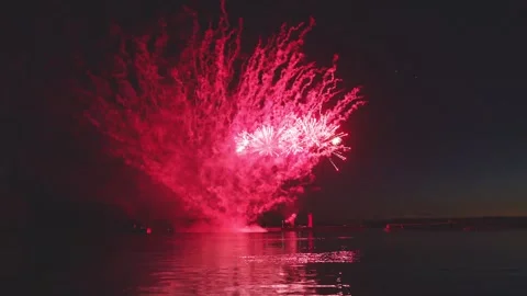 Continuous colorful fireworks display over sea with bright water reflection Stock Footage 340632766