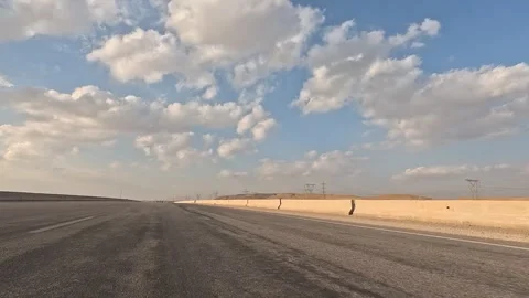 Continuous Driving Across Wide Desert Highway Between Cairo and Ain Sokhna Stock Footage 329967373