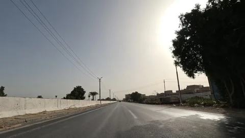 Continuous driving journey across Cairo Fayoum Desert Road through desert Stock-Footage 329831051