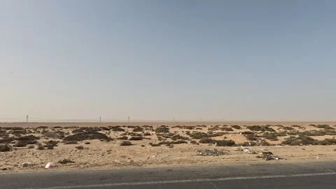 Continuous driving journey along Cairo Fayoum Desert Road through calm desert Stock Footage 329846884