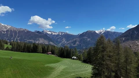Continuous Drone Flight Forward Over Alpine Field and Cabin in Northern Vídeo Stock 338316771