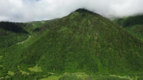 Continuous Drone Side Flight Over Glowing Mountain Slopes 4K RAW Stock Footage 339737616