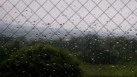 Continuous falling rain, close-up of window glass and raindrops, dark atmos.. Stock Footage 328484004