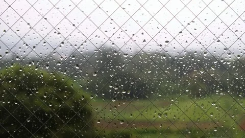 Continuous falling rain, , close-up of window glass and raindrops, backgrou.. Video stock 328486435