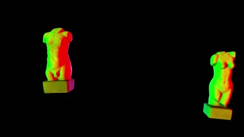 The continuous flashing of colored rays paints the antique torsos of a man and a Stock Footage 155529740