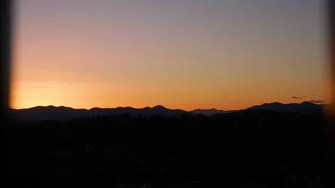 Continuous focus push in shot of mountains during sunrise or sunset Stock Footage 145738484