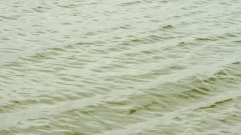 Continuous gentle ocean water waves and ripples, 4K 30p Stock Footage 75397231