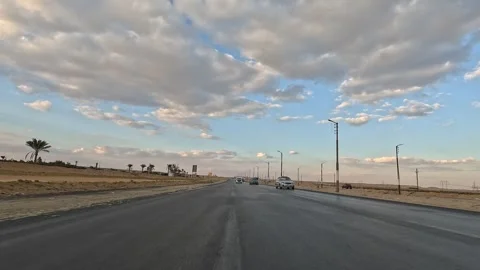 Continuous highway drive along Cairo Fayoum Desert Road through peaceful desert Stock-Footage 330081771