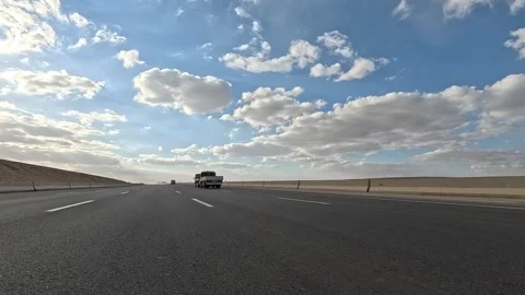 Continuous Highway Traffic Across Desert Landscape Between Cairo and Ain Sokhna Stock Footage 330037569