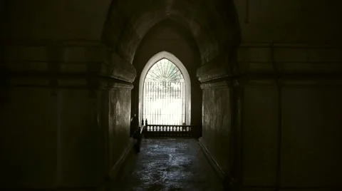A continuous pan reveals the hallways and windows of an ancient temple. Stock Footage 49046513