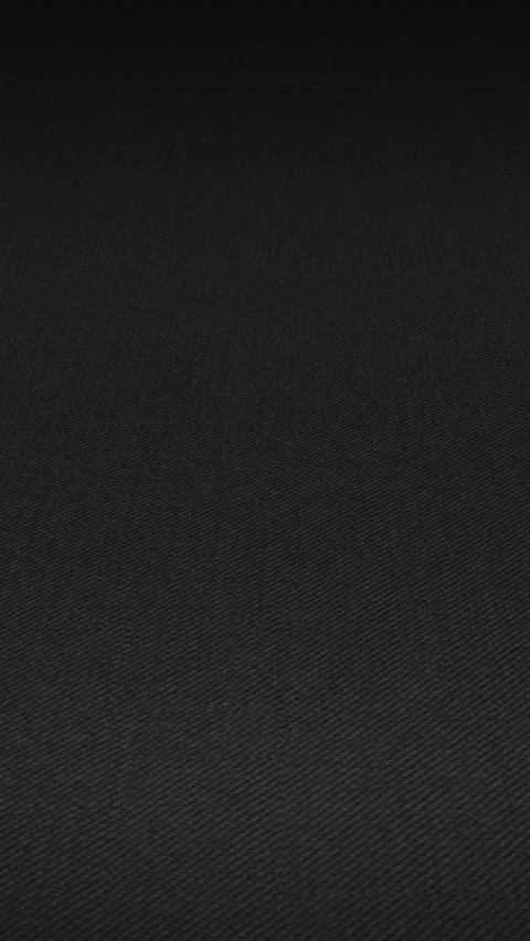 Continuous panning motion across Italian black stretch wool twill fabric 스톡 동영상 343211663