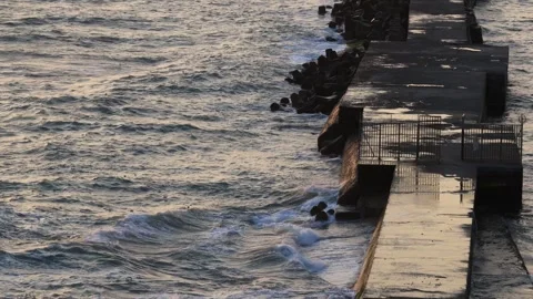Continuous, powerful waves hit the ancient breakwater. The combination of shock. 스톡 동영상 278032993