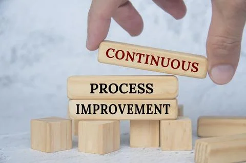 Continuous process improvement text on wooden blocks. Continuous improvement 写真素材